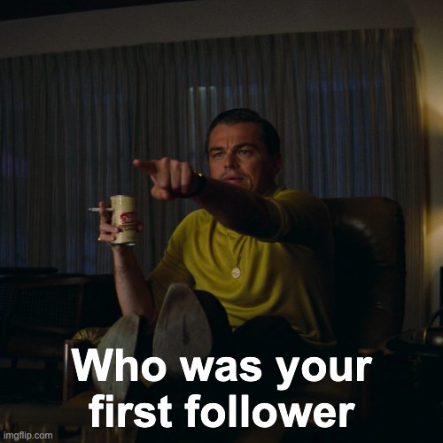 Leonardo-DiCaprio-pointing-at-the-TV-with-a-drink-in-hand Why Everyone Loves Leonardo DiCaprio Memes: From Pointing to Toasting